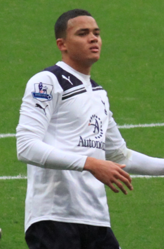 Jermaine Jenas smiling at a sports venue