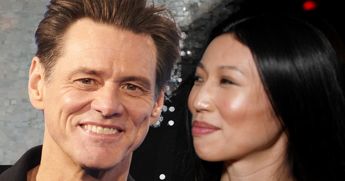 Jim Carrey and Min Ah in Paris formal setting