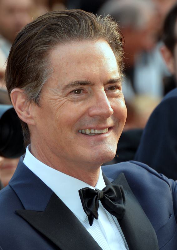 Kyle MacLachlan smiling on red carpet