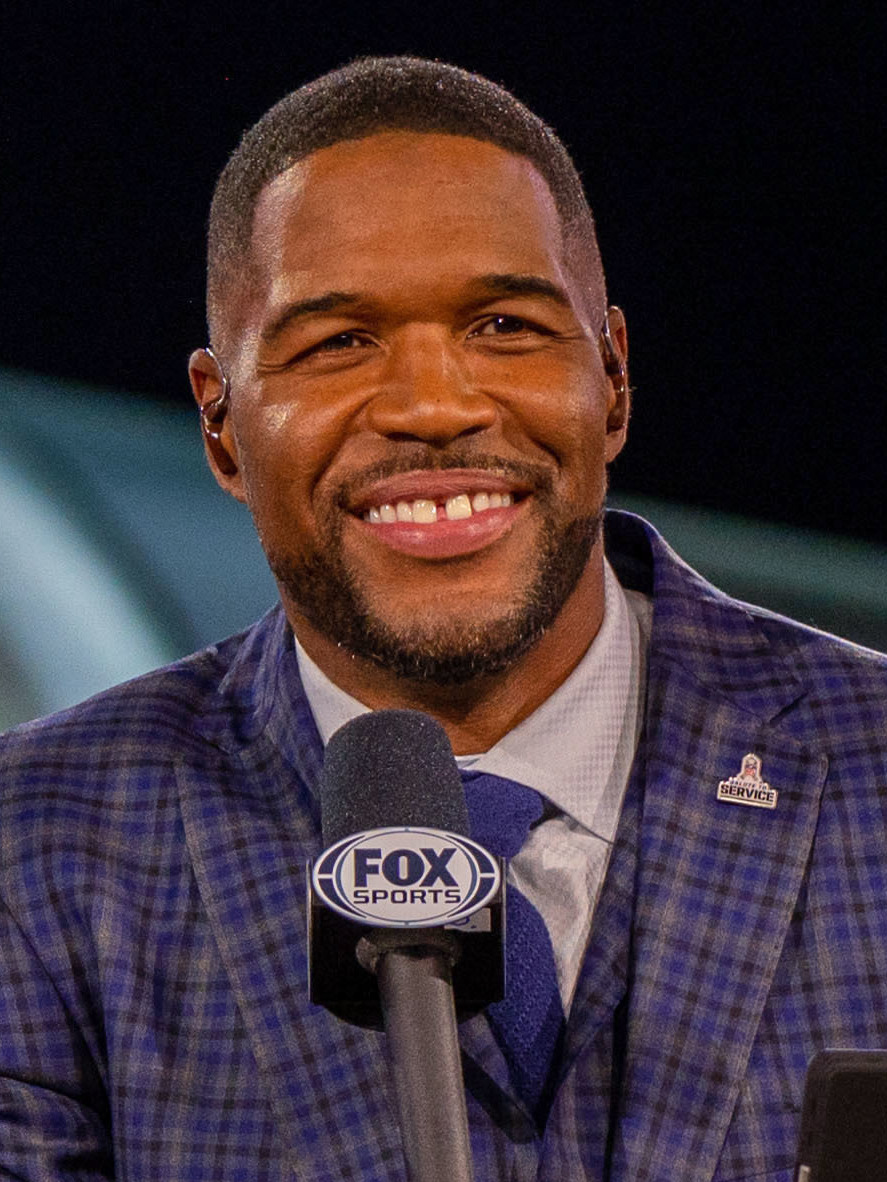 Michael Strahan smiling at public event