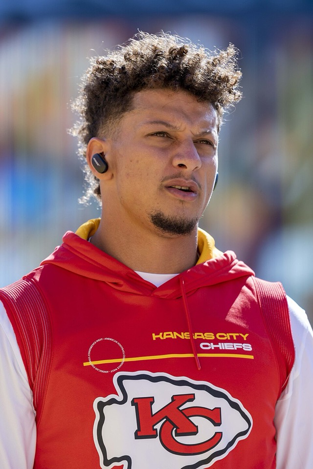 Patrick Mahomes on the football field preparing for game