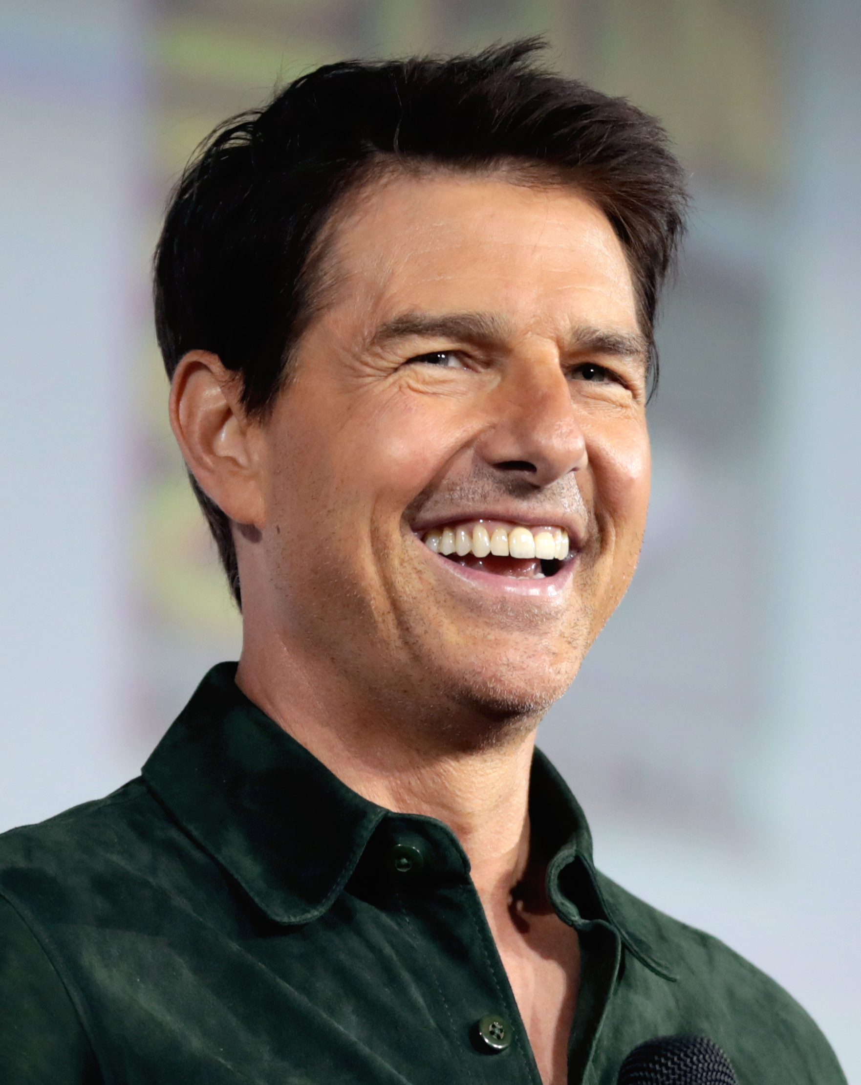 Tom Cruise speaking at an entertainment event