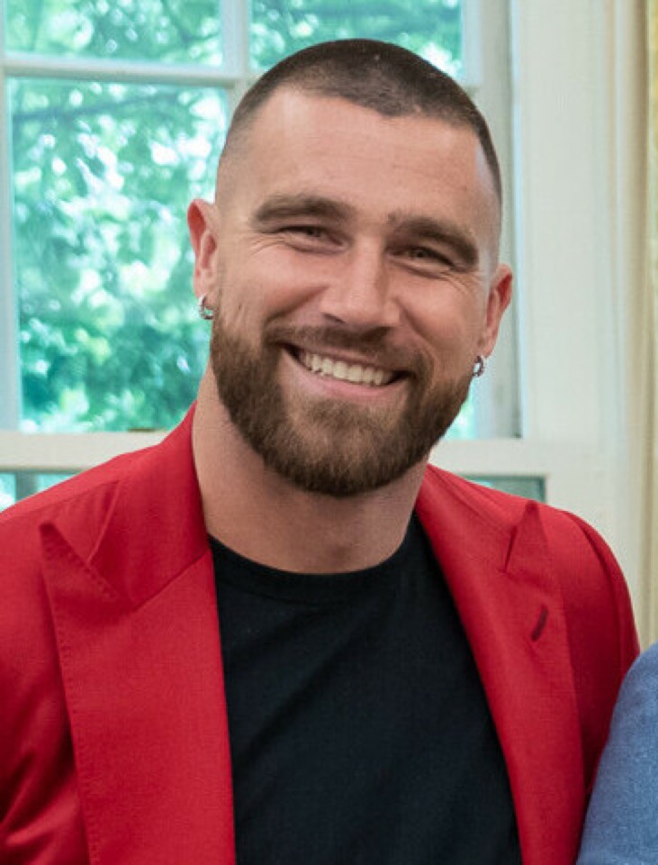 Travis Kelce celebrating victory on field
